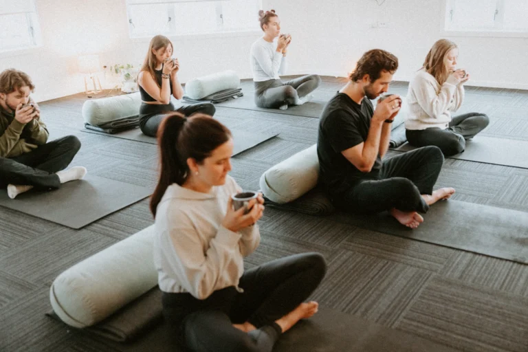 Group sharing a warm drink after breathwork
