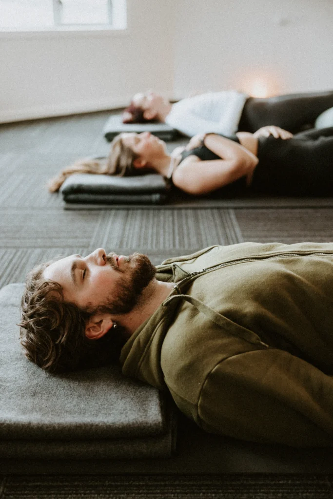 Participants resting during a guided breathwork session